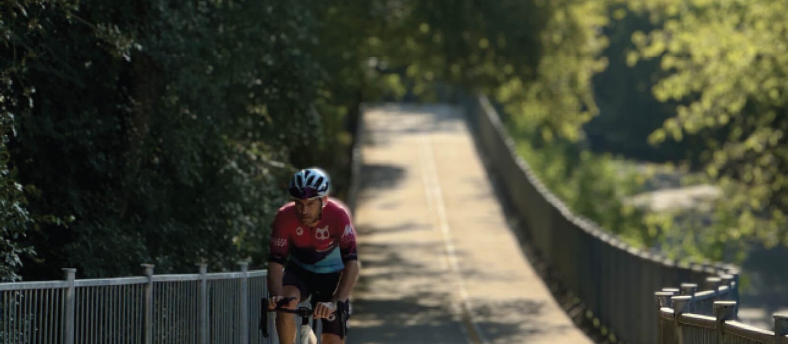 Outside shot of a bicyclist on the bike trail in East Austin.